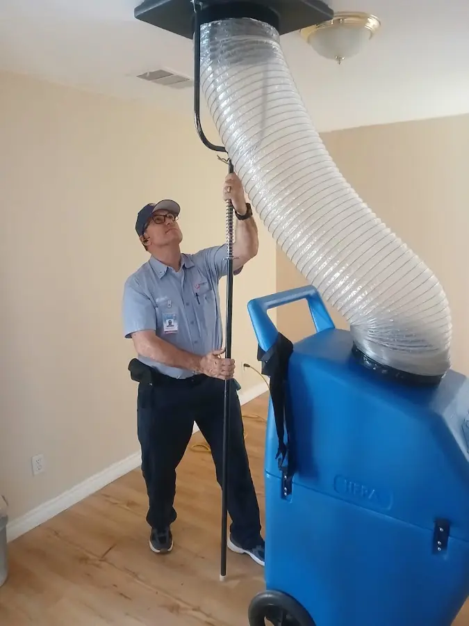 Furnace Tune-Up technician using HEPA equipment in Orinda
